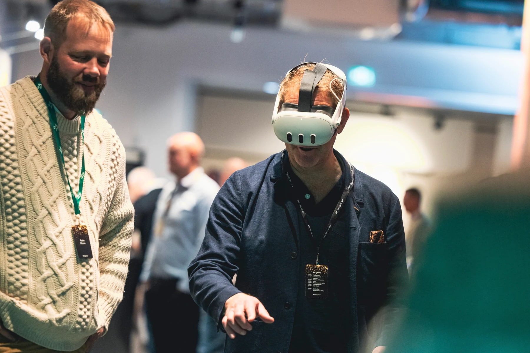 A guest experiencing Tidsresan in a VR headset with guidance from the team